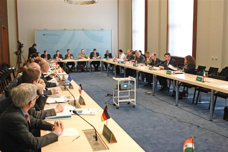 CSLF representatives gathered around four tables arranged in a rectangle