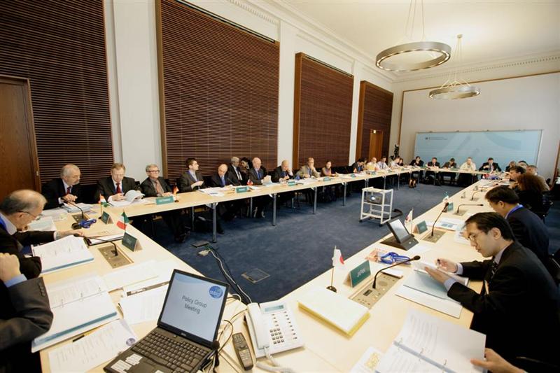 CSLF representatives gathered around four tables arranged in a rectangle