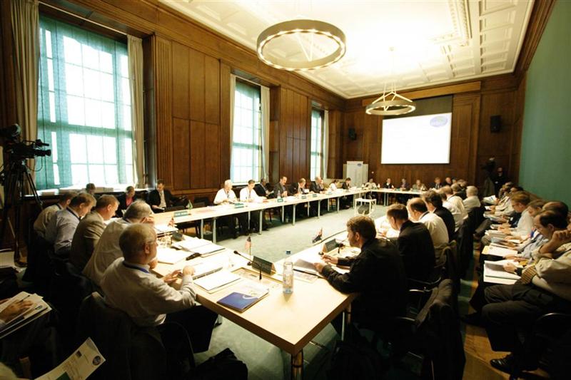 CSLF representatives gathered around four tables arranged in a rectangle