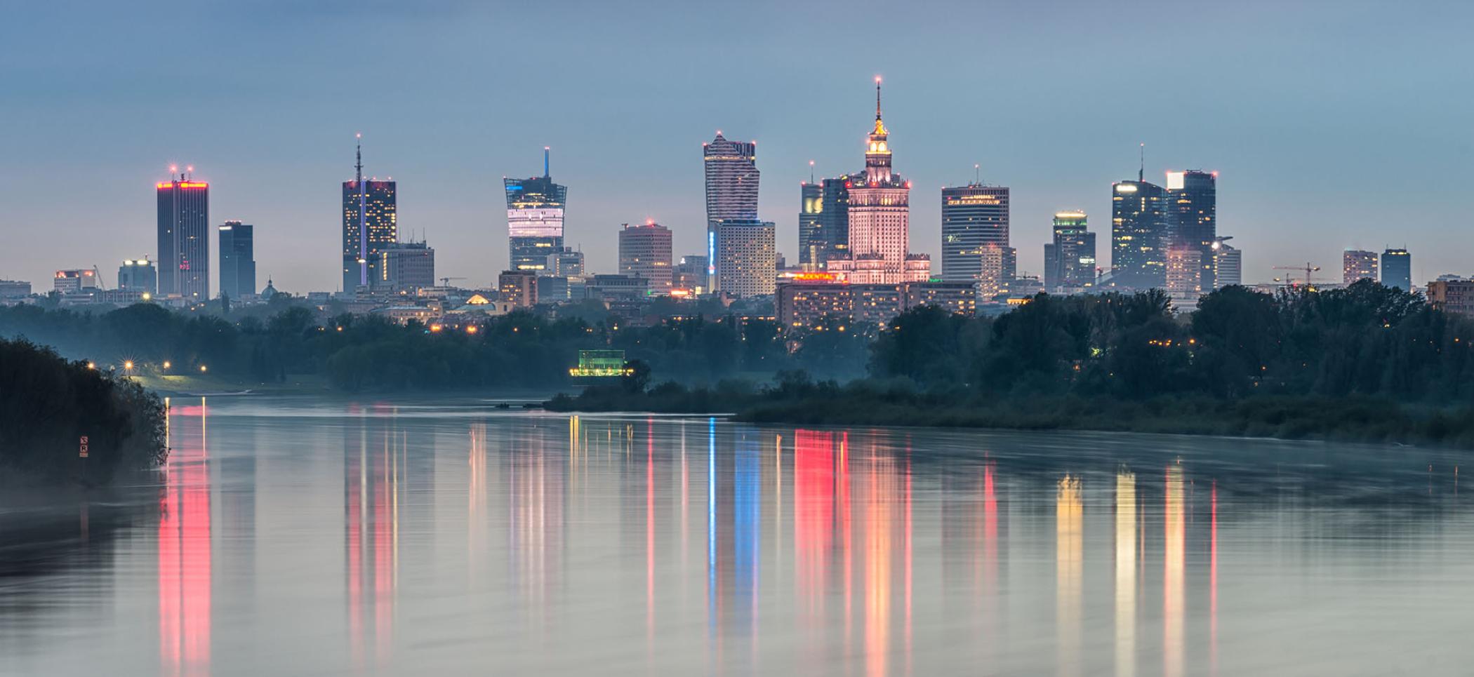 Night panorama of Warsaw skyline, Poland, over Vistula river in the night